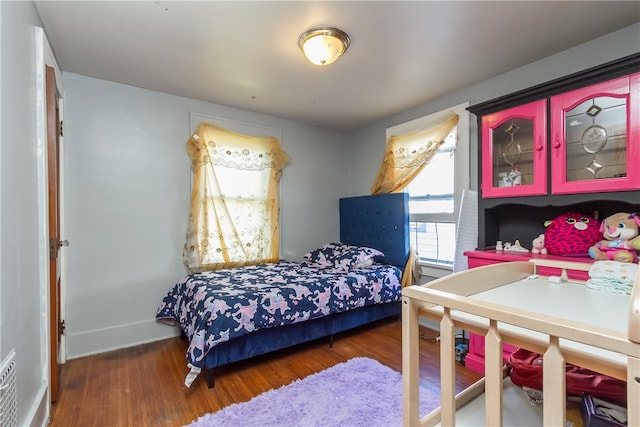 bedroom featuring dark wood-type flooring