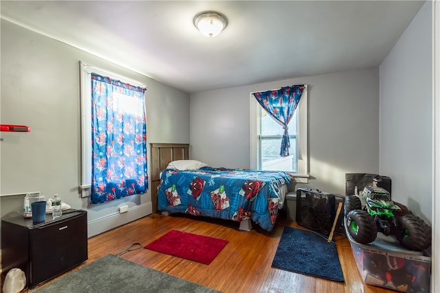 bedroom with wood-type flooring