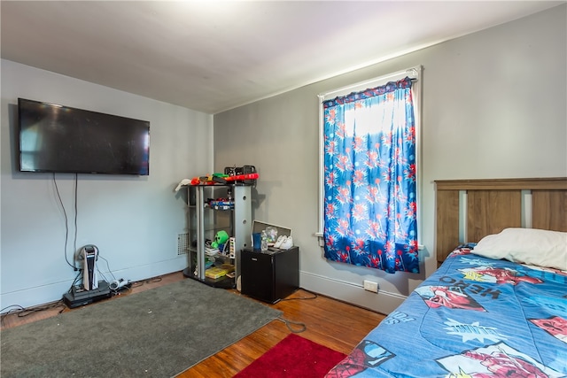 bedroom with hardwood / wood-style floors