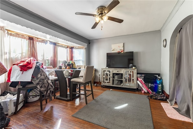 dining space featuring ornamental molding, dark hardwood / wood-style flooring, and ceiling fan