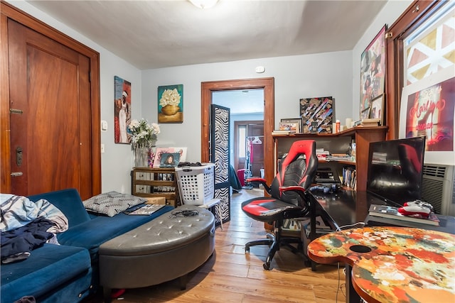 sitting room with light hardwood / wood-style flooring