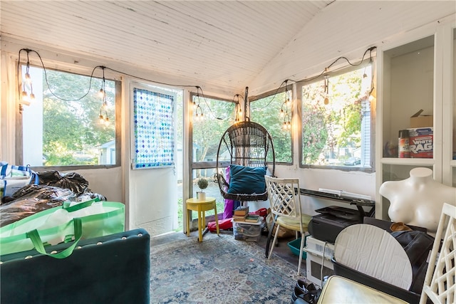 sunroom featuring lofted ceiling