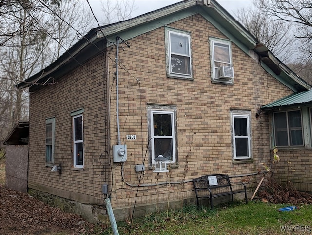 view of side of home featuring cooling unit