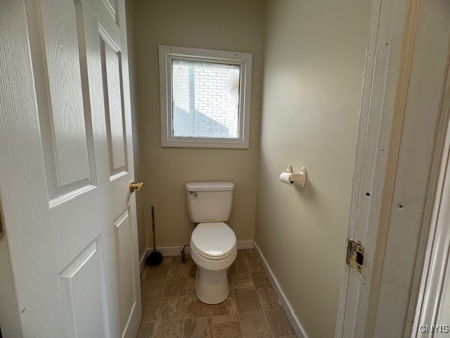 bathroom featuring toilet