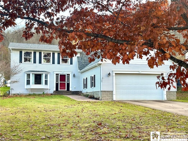 view of front facade featuring a garage and a front lawn