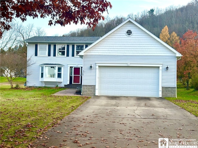 view of front of property featuring a garage and a front yard