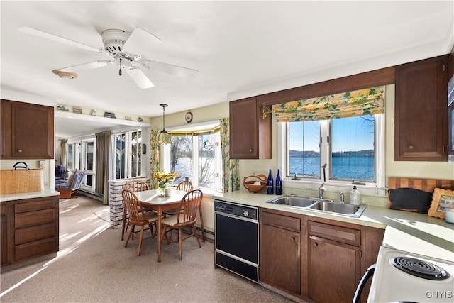 kitchen with hanging light fixtures, sink, dishwasher, a water view, and ceiling fan