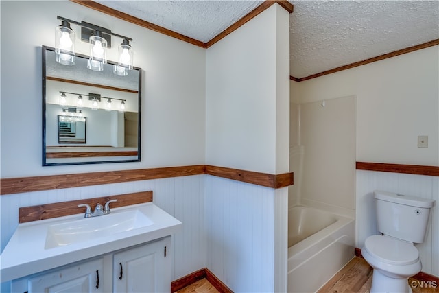 bathroom with hardwood / wood-style flooring, a textured ceiling, and crown molding