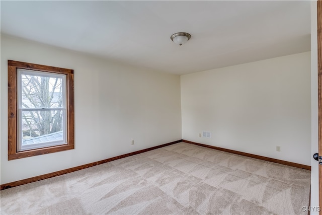 empty room with light colored carpet