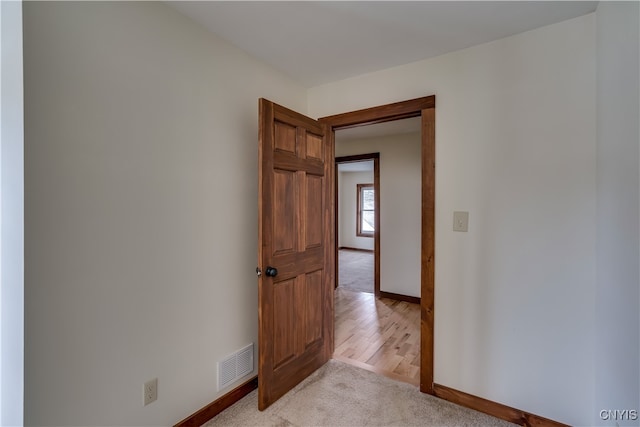 empty room with light hardwood / wood-style floors