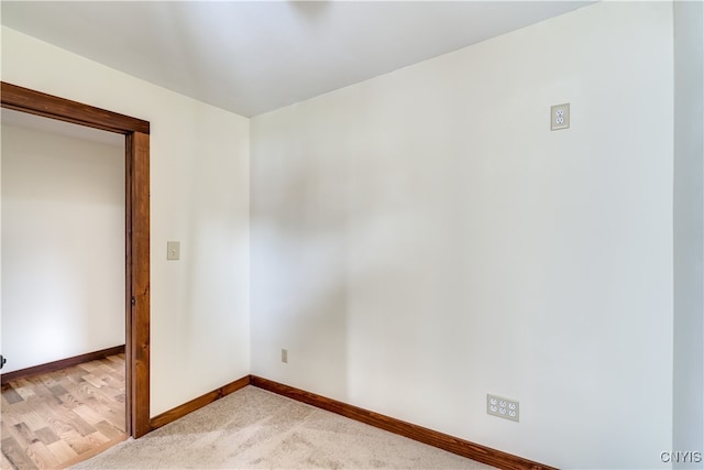 empty room with light hardwood / wood-style flooring