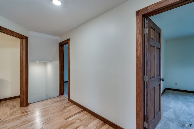 hallway with light wood-type flooring