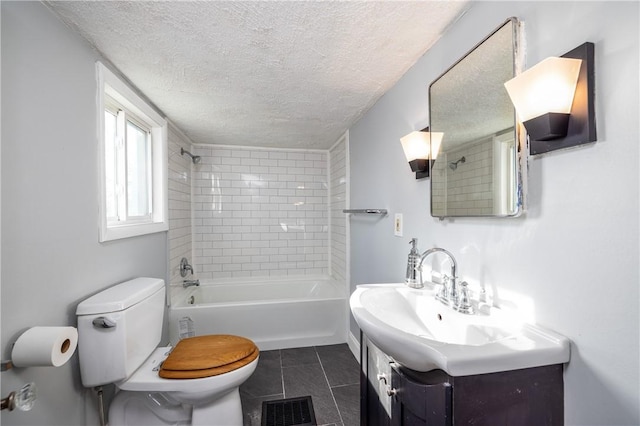 bathroom featuring a textured ceiling, vanity, toilet, tile patterned flooring, and visible vents