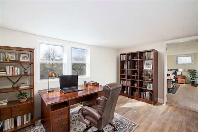 office space with light wood finished floors