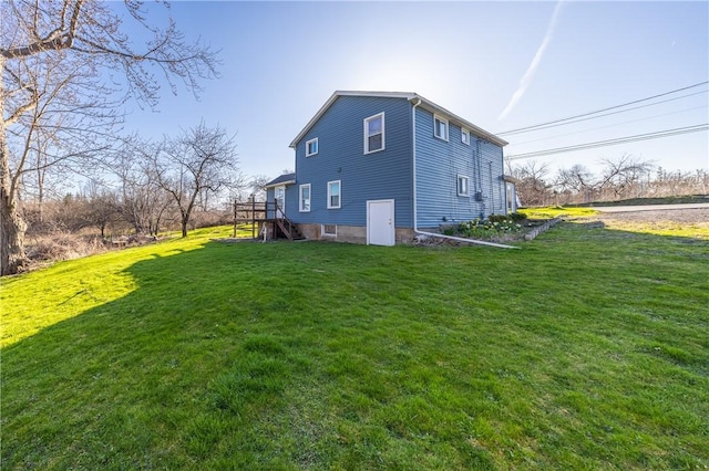 view of side of home featuring a yard