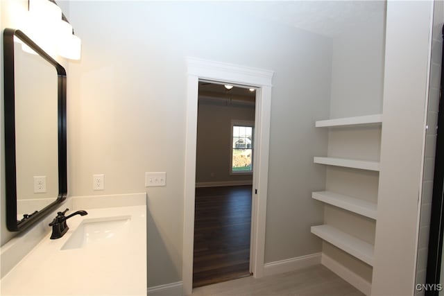 bathroom with vanity and hardwood / wood-style floors