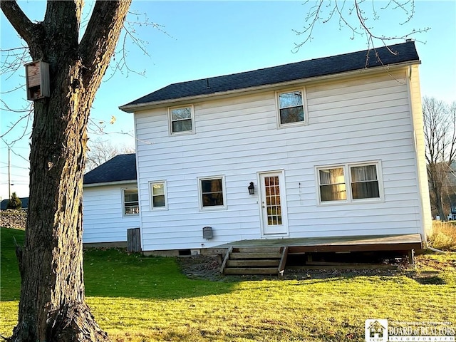 back of house with a lawn