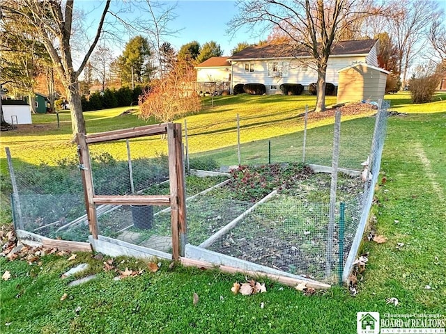 view of gate with an outbuilding and a lawn