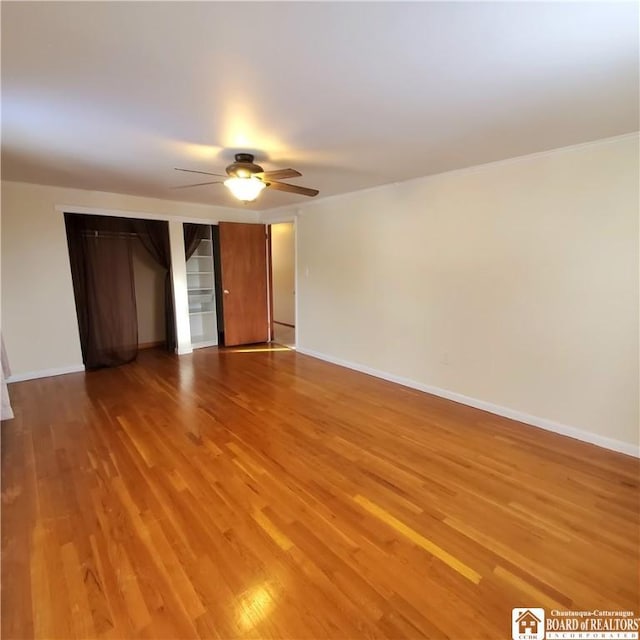 unfurnished room featuring hardwood / wood-style flooring and ceiling fan