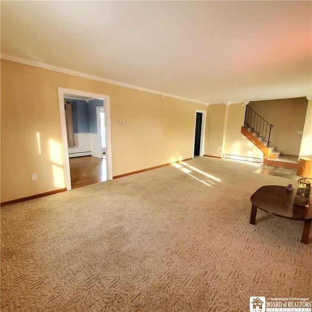 unfurnished living room with baseboard heating, ornamental molding, and carpet