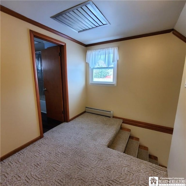 empty room featuring a baseboard radiator, ornamental molding, and light colored carpet