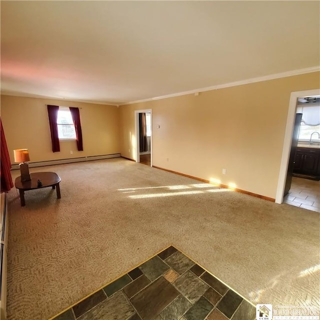 unfurnished living room with crown molding, carpet floors, and baseboard heating