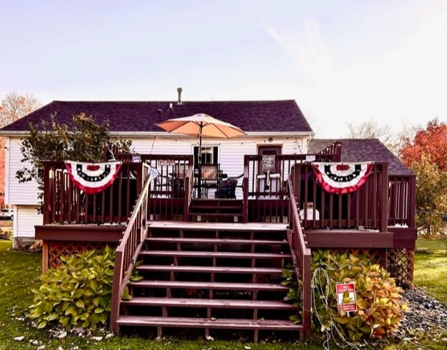 rear view of house with a wooden deck