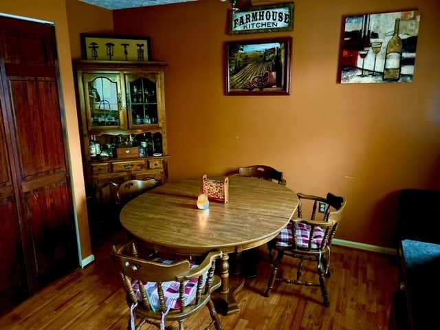 dining area with hardwood / wood-style flooring