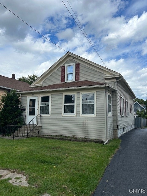 view of home's exterior featuring a yard