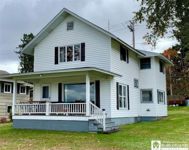 view of front of home with covered porch and a front yard