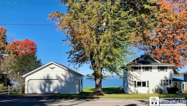 view of property exterior featuring an outdoor structure and a lawn