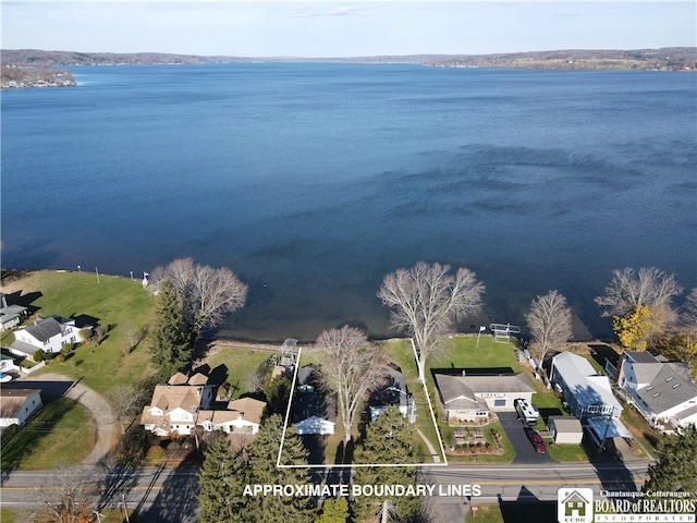 birds eye view of property featuring a water view