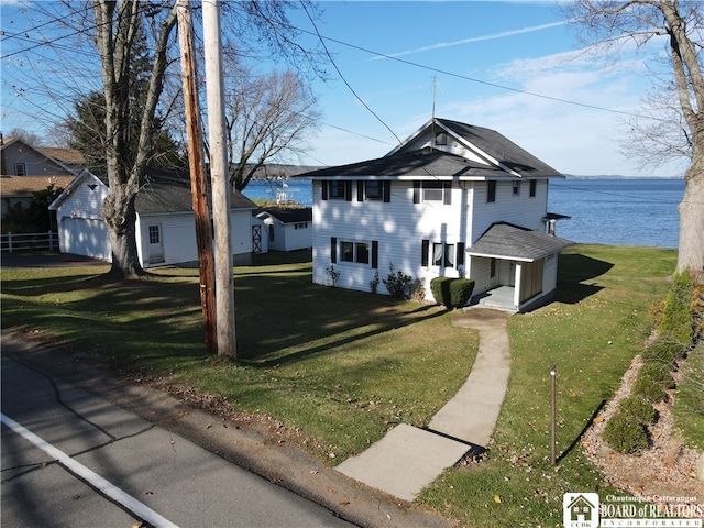 view of front facade with a water view and a front yard