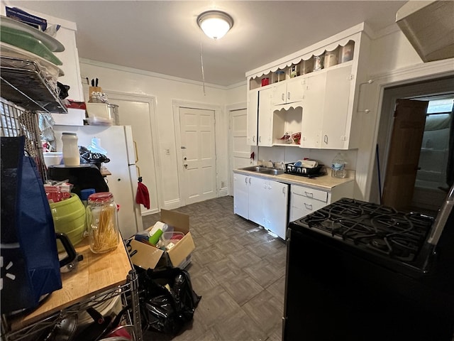 kitchen featuring white cabinetry, sink, black stove, and ornamental molding