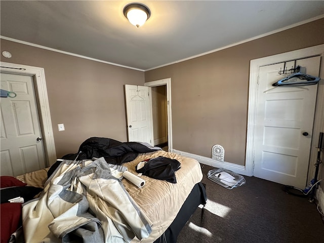 bedroom featuring dark colored carpet and crown molding