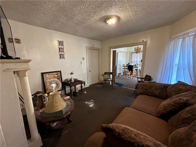 carpeted living room featuring a textured ceiling