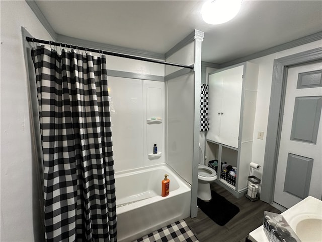 full bathroom featuring wood-type flooring, shower / bath combo with shower curtain, toilet, ornamental molding, and vanity