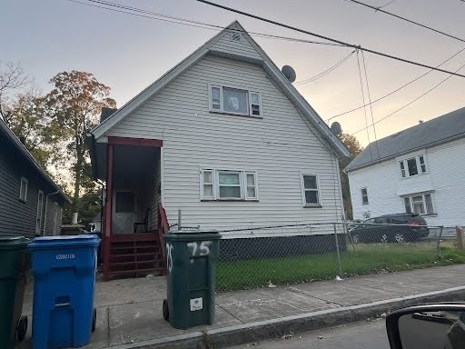 view of back house at dusk