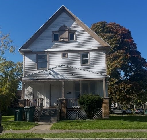 view of front of home featuring a front lawn and a porch