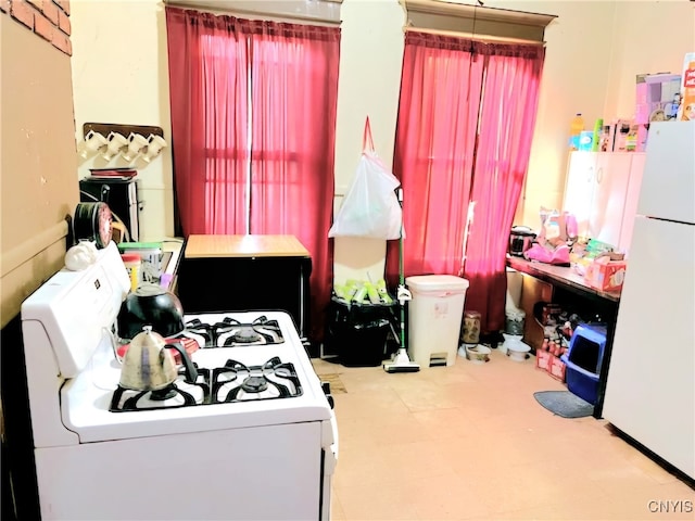 bedroom featuring white fridge