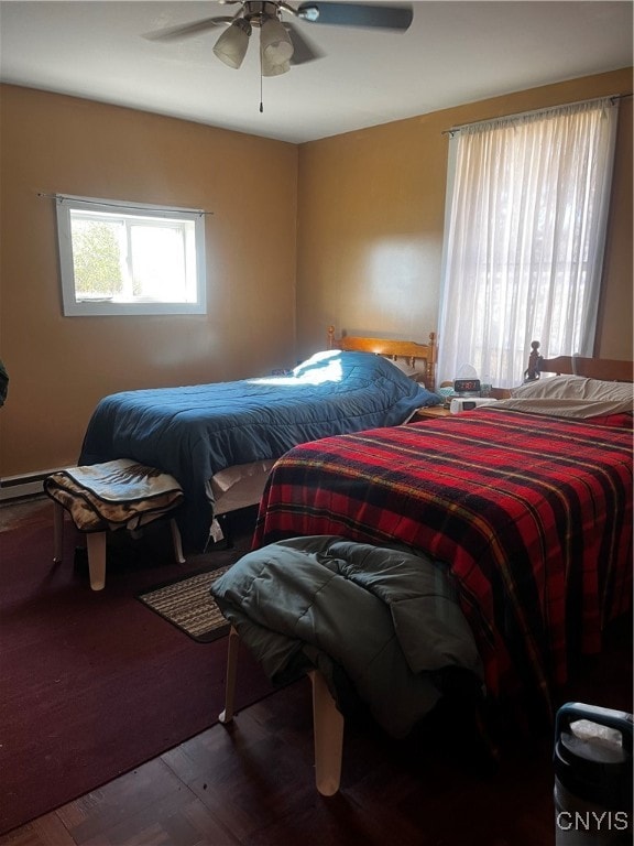 bedroom featuring ceiling fan and wood-type flooring