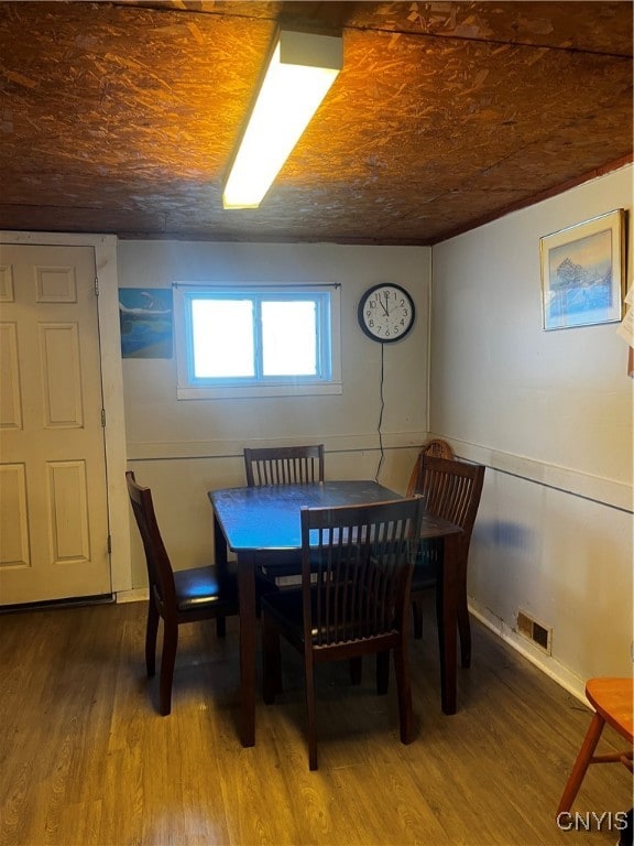 dining area with hardwood / wood-style flooring