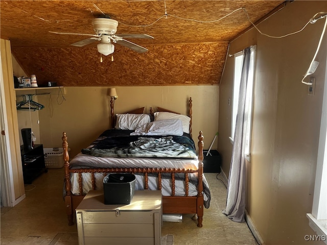 bedroom featuring ceiling fan and vaulted ceiling