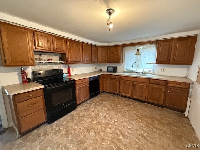 kitchen with black appliances and sink