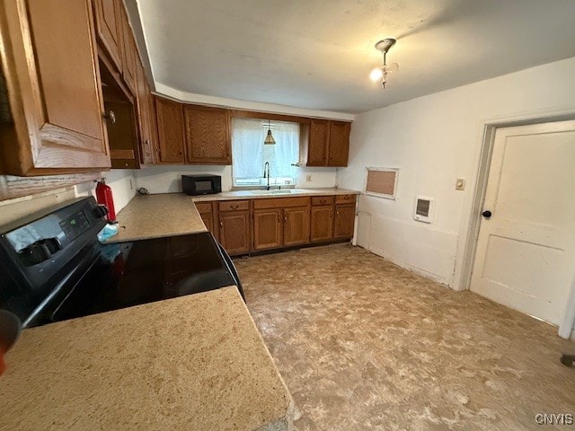 kitchen with sink and black appliances