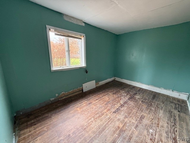 unfurnished room featuring hardwood / wood-style floors