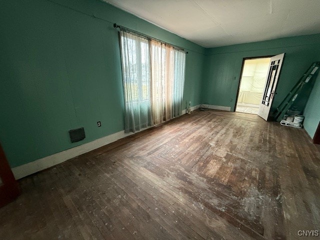 empty room featuring dark hardwood / wood-style floors