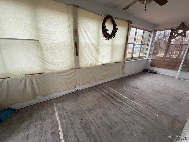 unfurnished room with hardwood / wood-style floors and ceiling fan