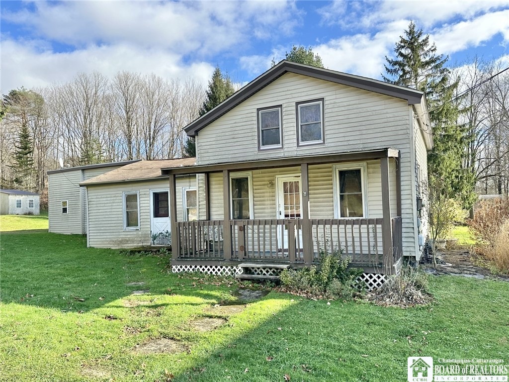 view of front of home with a porch and a front yard