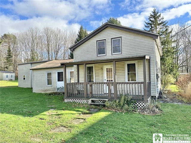 view of front of home with a porch and a front yard